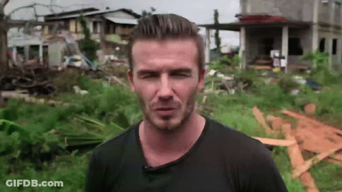 Man In Black Shirt In Field With House GIF