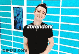 Man In Black Shirt In Front Of Blue Brick Wall #Brendork GIF