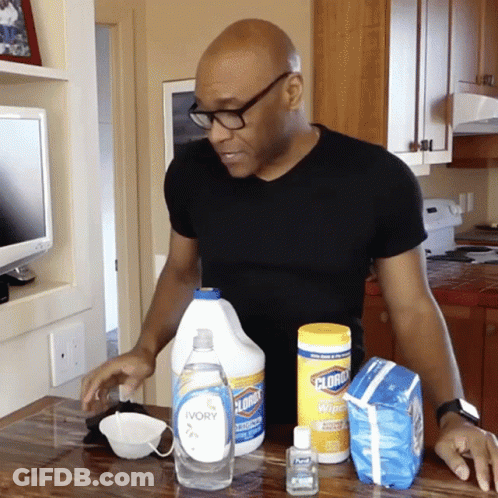 Man In Black Shirt In Front Of Clorox Bottle GIF