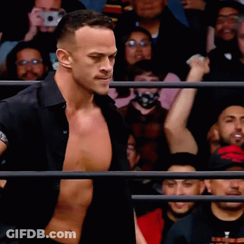 Man In Black Shirt In Front Of Crowd GIF