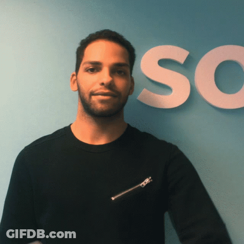 Man In Black Shirt In Front Of Sign Saying So GIF