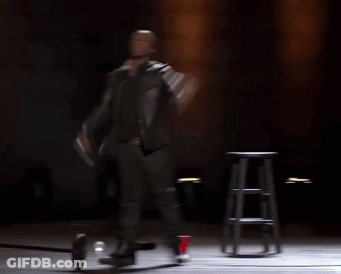 Man In Black Shirt Laughing With NFL Logo GIF