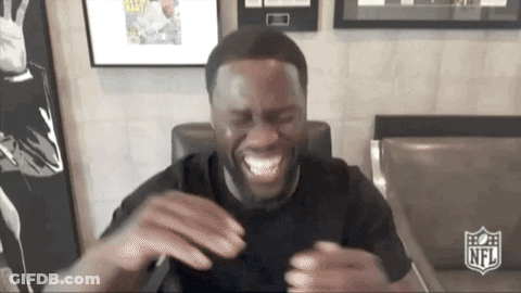 Man In Black Shirt Laughing With NFL Logo GIF