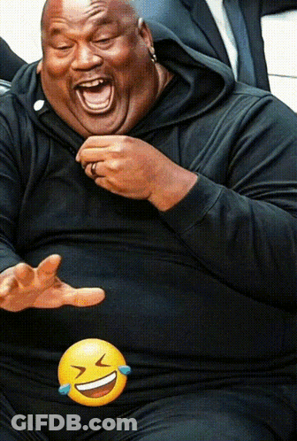 Man In Black Shirt Laughing With Yellow Smiley Face GIF