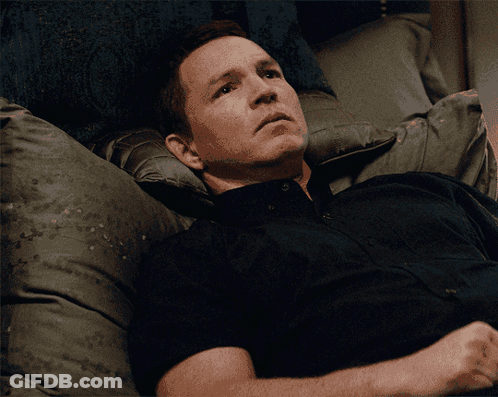 Man In Black Shirt Laying On Bed GIF