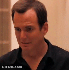 Man In Black Shirt Looking At Camera GIF