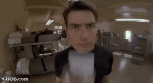 Man In Black Shirt Looking At Camera GIF