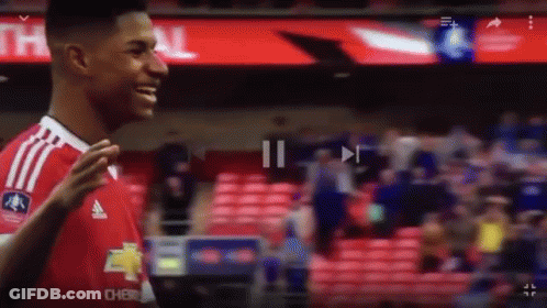 Man In Black Shirt Makes Funny Face To Crowd GIF