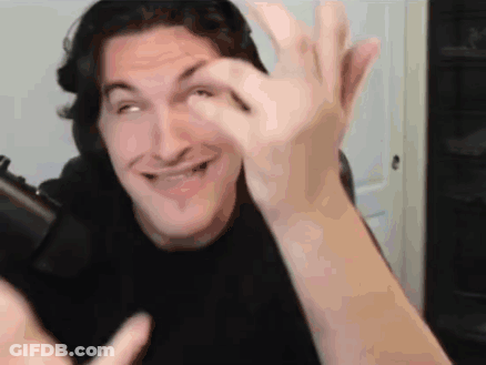 Man In Black Shirt Making Funny Face Holding Cell Phone GIF