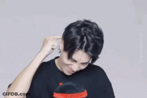 Man In Black Shirt Making Funny Face Holding Hand To Ear GIF