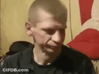 Man In Black Shirt Making Funny Face In Chair GIF