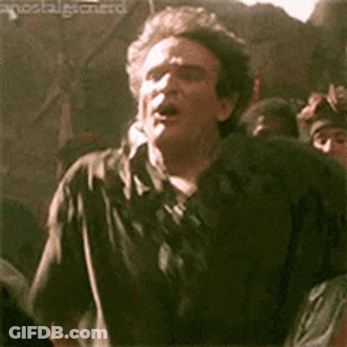 Man In Black Shirt Making Funny Face In Front Of Crowd GIF