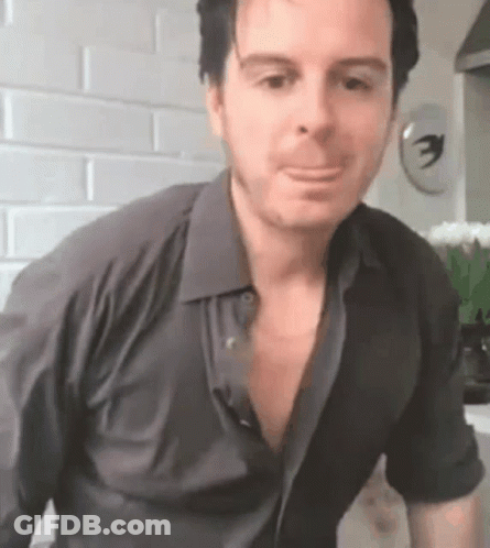Man In Black Shirt Making Funny Face GIF