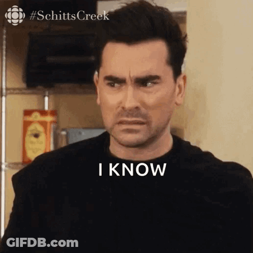 Man In Black Shirt Making Funny Face Saying I Know GIF