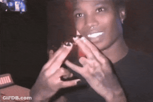Man In Black Shirt Making Peace Sign GIF