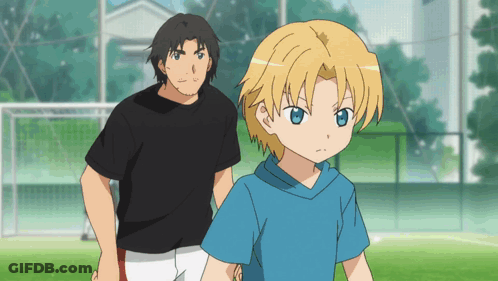 Man In Black Shirt Next To Boy With Blonde Hair GIF