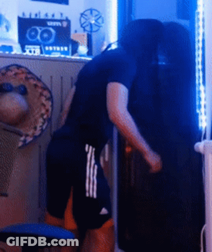 Man In Black Shirt Next To Man In Shorts GIF