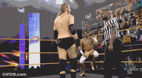 Man In Black Shirt Number 3 Hugging Another Man In Stadium GIF