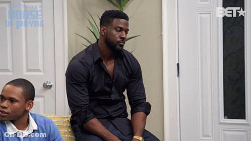 Man In Black Shirt On Couch In Front Of Beta Door GIF