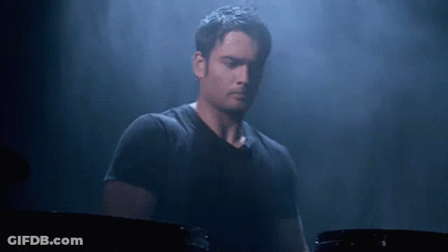 Man In Black Shirt Playing Drum Set GIF