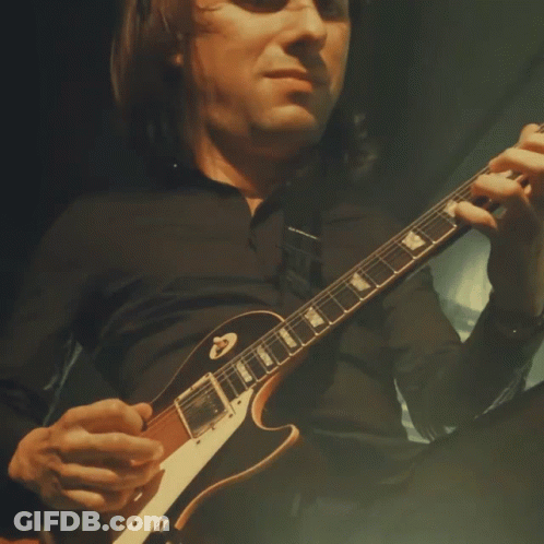 Man In Black Shirt Playing Gibson Guitar GIF