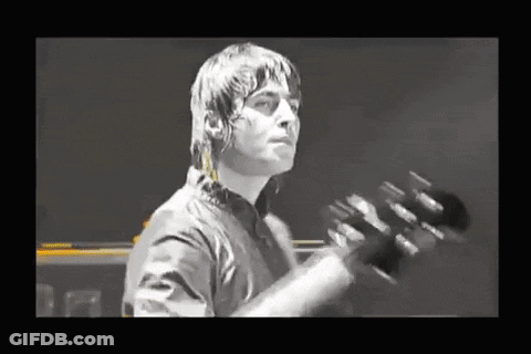 Man In Black Shirt Playing Guitar GIF