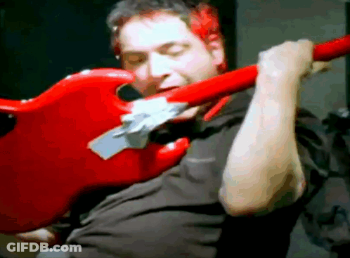 Man In Black Shirt Playing Red Electric Guitar GIF