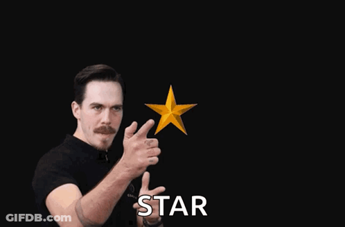 Man In Black Shirt Pointing At Gold Stars With Star GIF