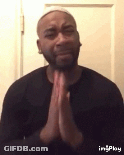 Man In Black Shirt Praying Before Door GIF