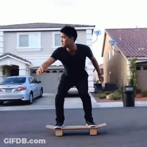 Man In Black Shirt Riding Skateboard GIF