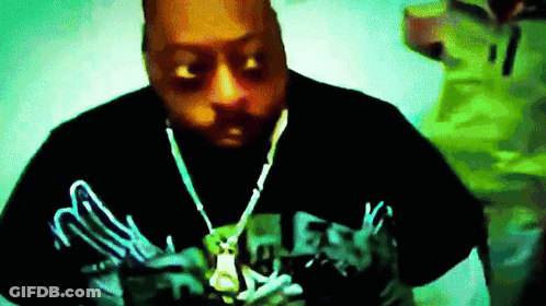 Man In Black Shirt Saying Guess GIF