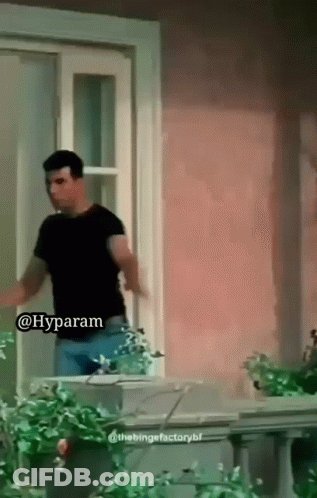 Man In Black Shirt Saying Hyparam At Window GIF