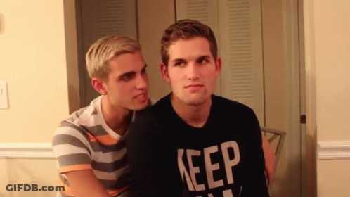 Man In Black Shirt Saying Keep Talks To Another Man GIF