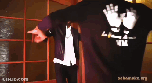 Man In Black Shirt Saying LP Next To Another Man GIF