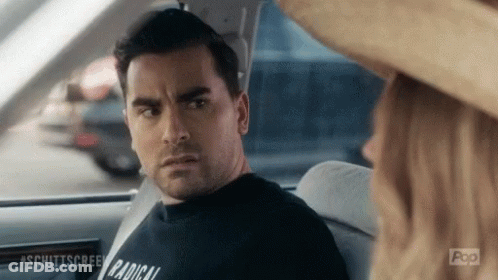 Man In Black Shirt Saying Radical Sits In Car GIF