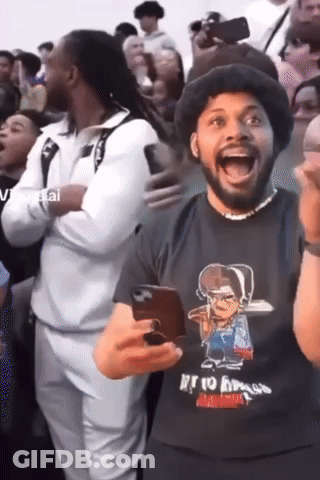 Man In Black Shirt Saying Rio Bravo Holding Phone GIF