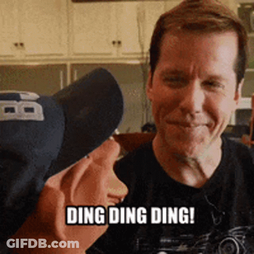 Man In Black Shirt Says Ding Ding Ding GIF