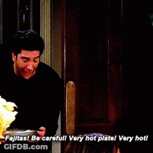 Man In Black Shirt Says Fajitas Be Careful Very Hot Plate GIF