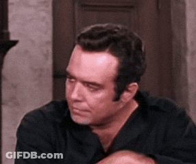 Man In Black Shirt Scratching Head GIF