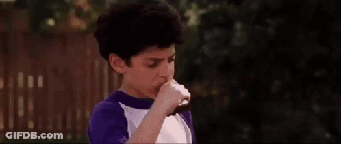 Man In Black Shirt Shaking Hands With Boy In Purple Shirt GIF