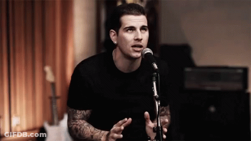 Man In Black Shirt Singing Into Microphone GIF