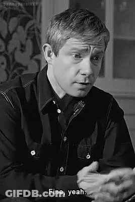 Man In Black Shirt Sitting And Talking GIF