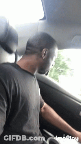Man In Black Shirt Sitting In Car GIF