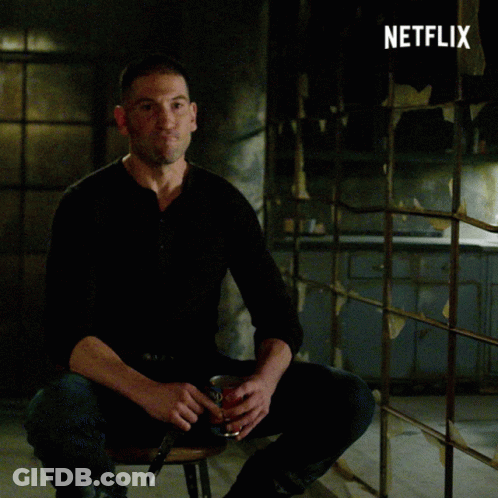 Man In Black Shirt Sitting In Front Of Netflix GIF