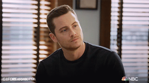 Man In Black Shirt Sitting In Front Of Window Hashtag Chicagopd GIF