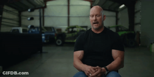 Man In Black Shirt Sitting In Garage GIF
