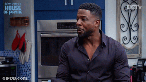 Man In Black Shirt Sitting In Kitchen With Tyler Perry's House Of Payne GIF