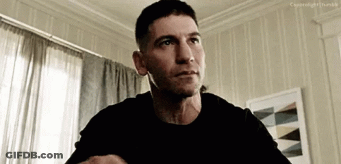 Man In Black Shirt Sitting In Living Room GIF