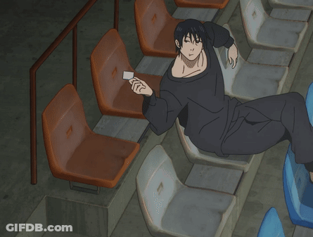 Man In Black Shirt Sitting In Row Of Seats GIF