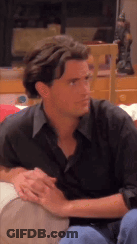 Man In Black Shirt Sitting On Couch GIF